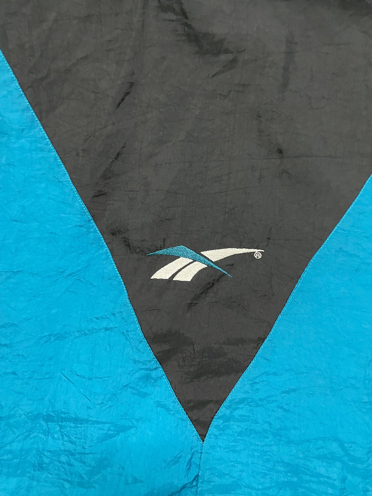 Vintage 1990s Reebok blue black and white windbreaker