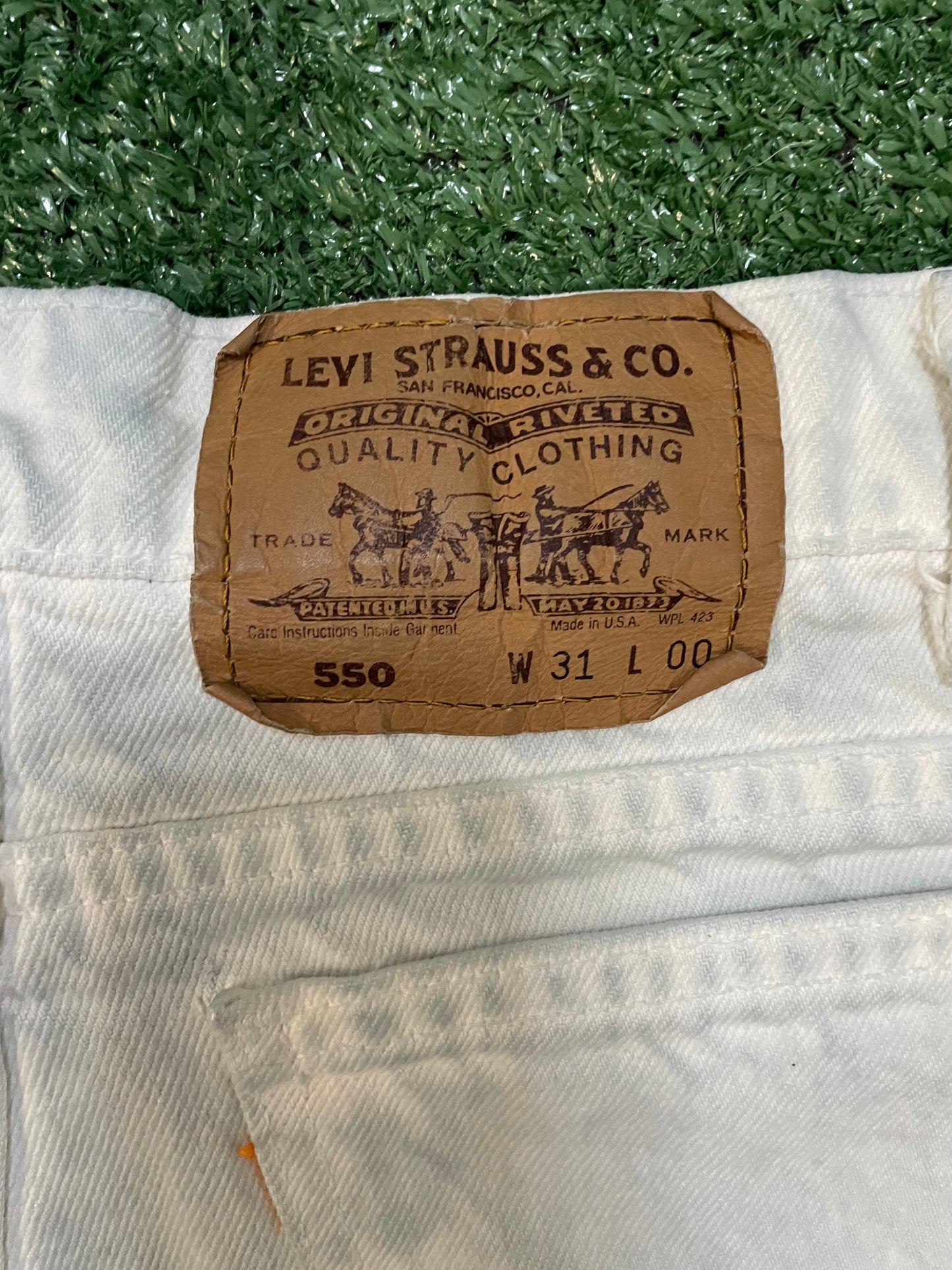 Vintage 1990s Levi 550 orange tab light wash jean shorts