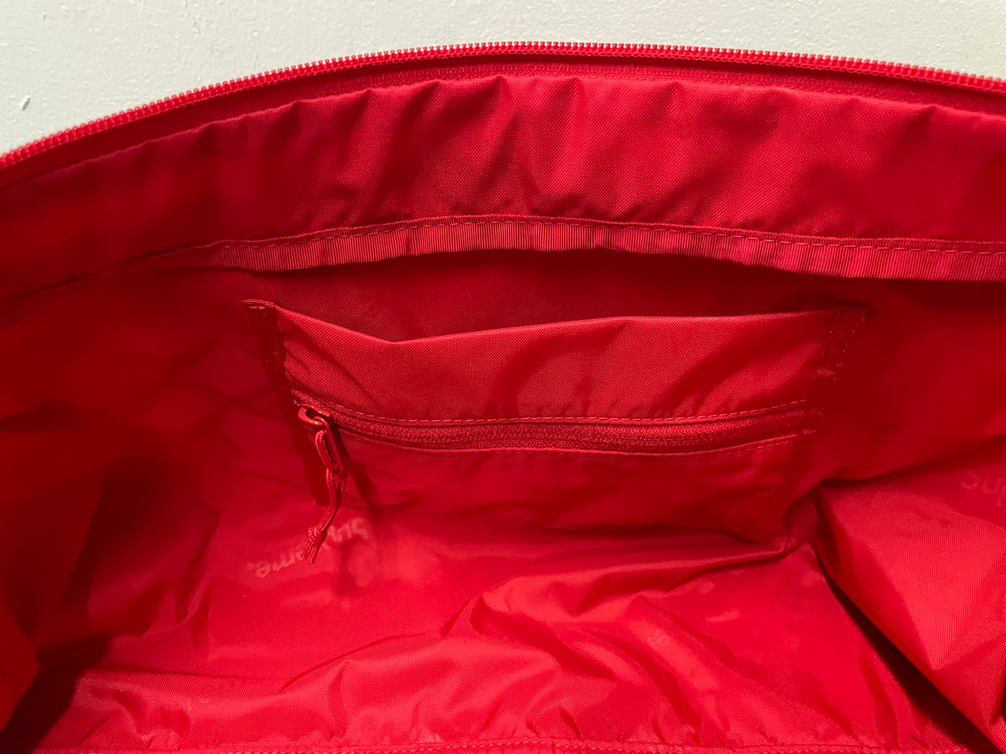 Supreme red duffle bag FW24