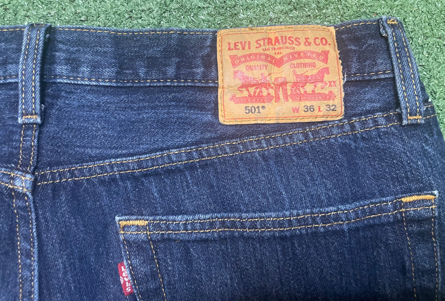 Levi’s 501 dark wash blue jeans