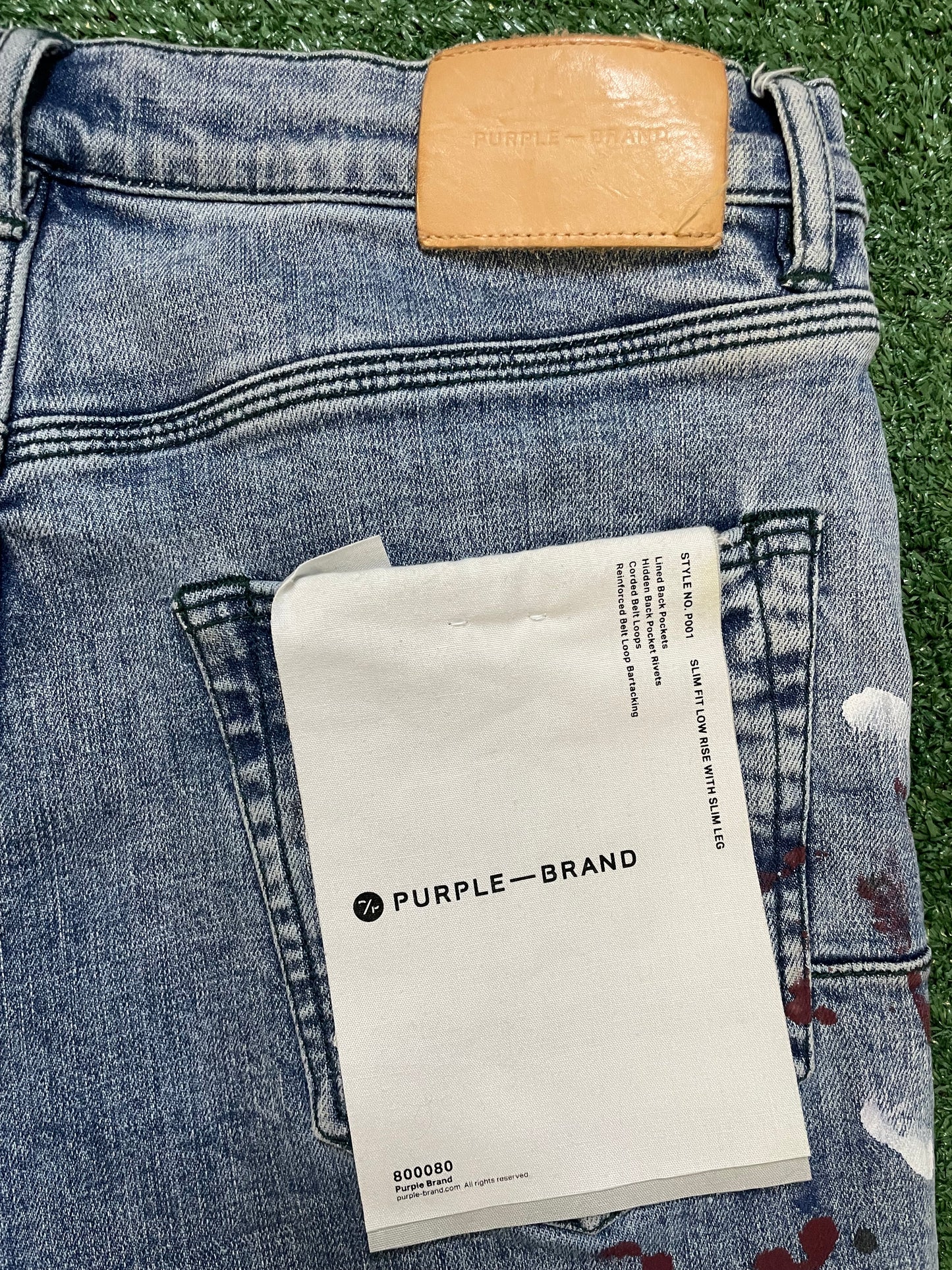 Purple brand paint splatter jeans