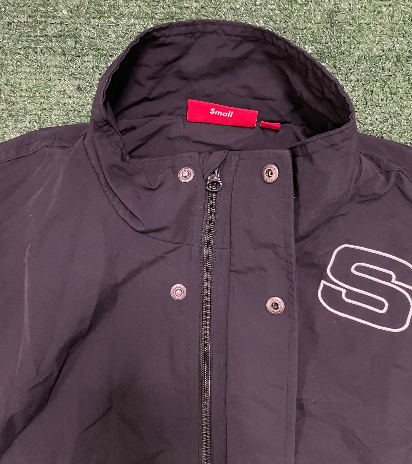 Supreme spellout embroidered black track jacket