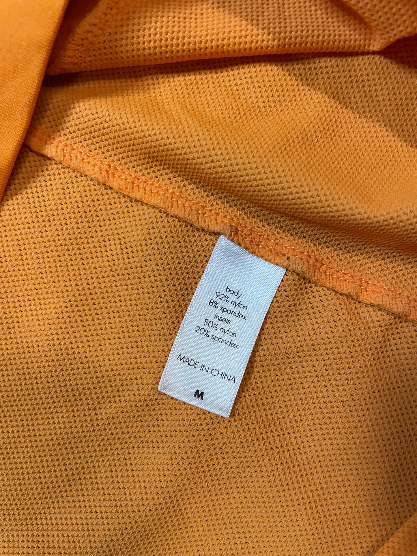 orange short sleeve zip up