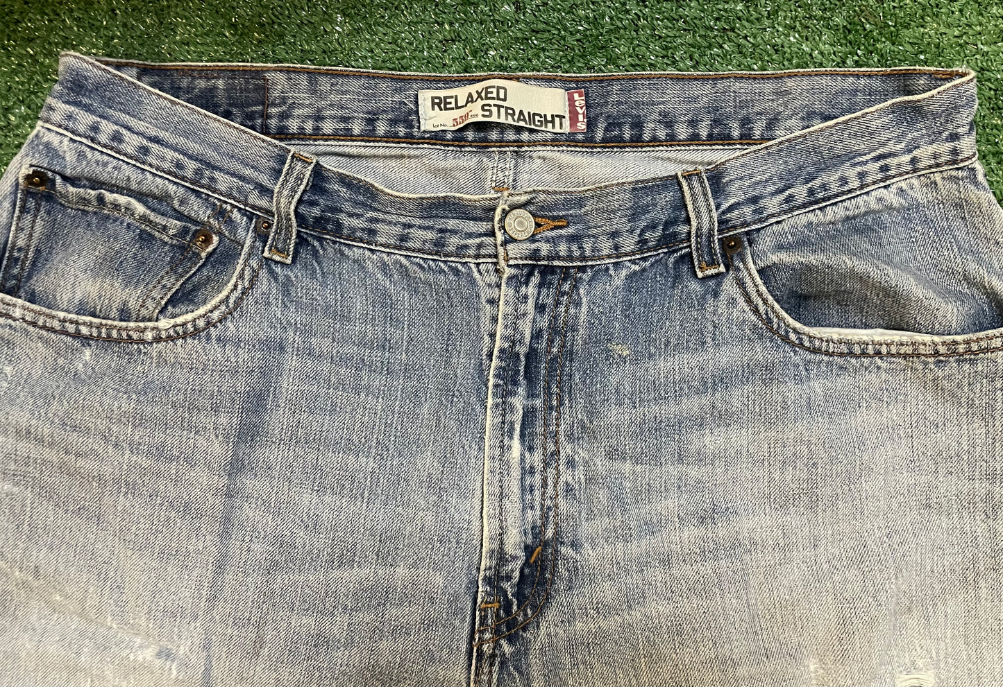 Levi 559 light wash distressed denim jeans