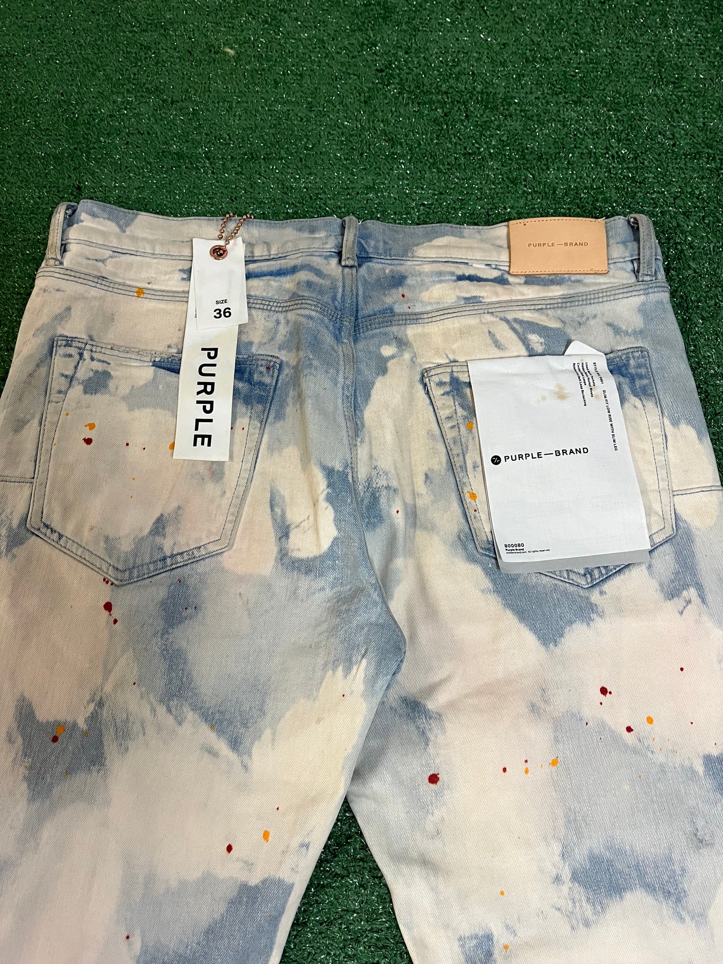 Purple Brand light wash paint splatter jeans