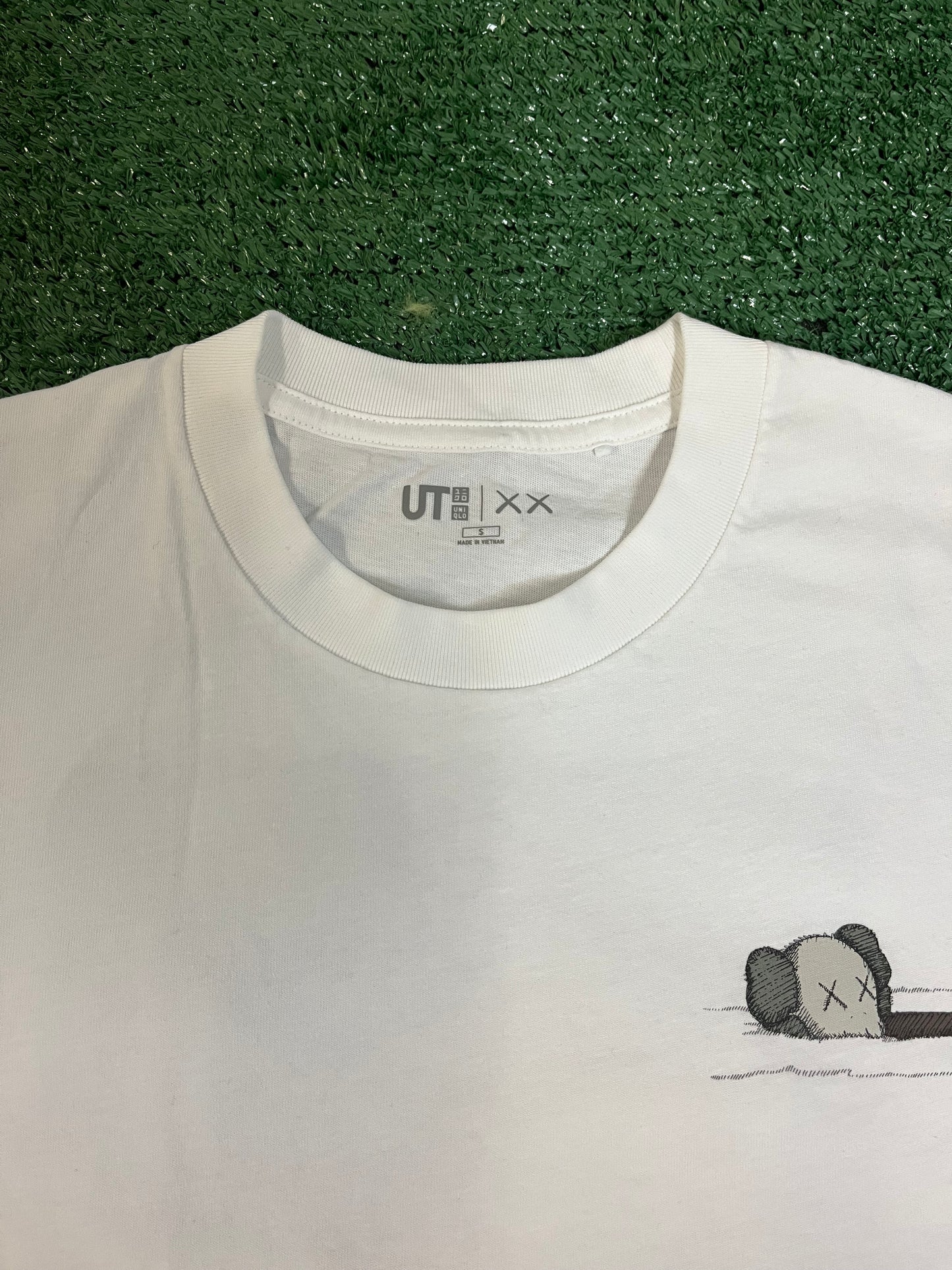 Kaws x Uniqlo floating artbook tee