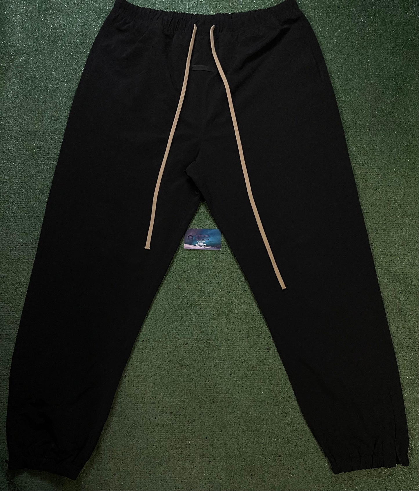 Fear of God Essentials black nylon track pants