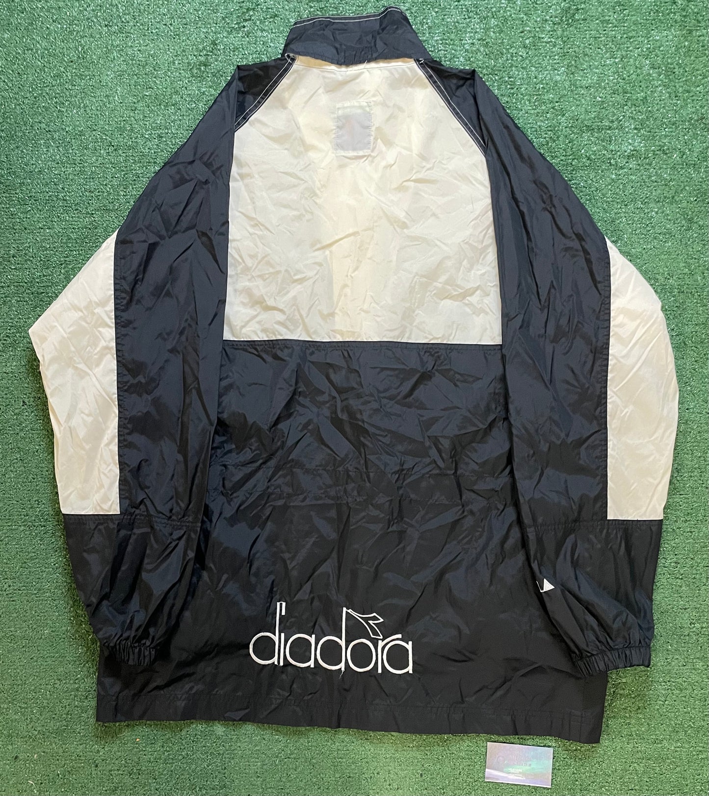 Vintage 1990s Diadora black and white windbreaker jacket