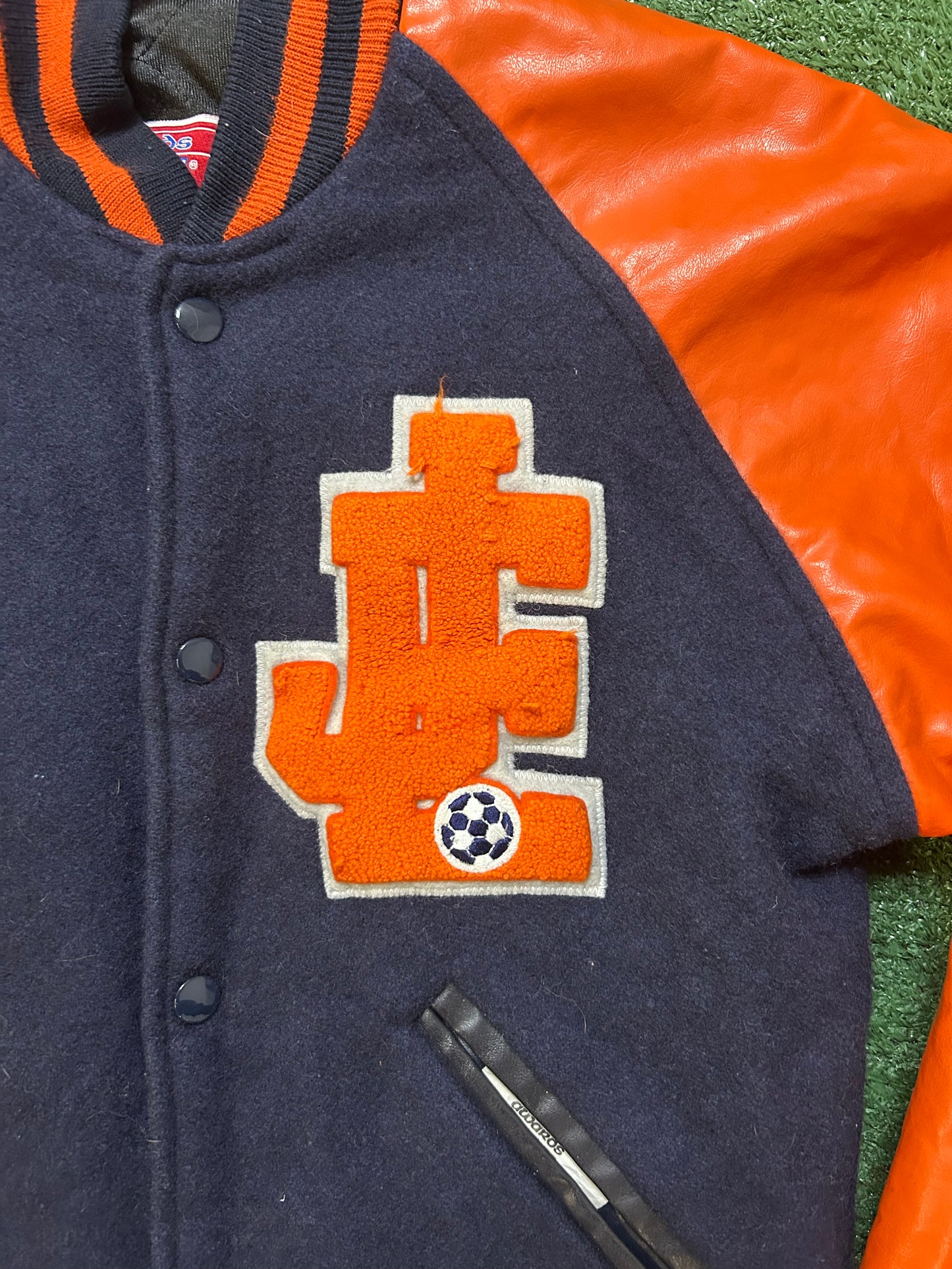 Vintage 1990s navy and orange varsity jacket