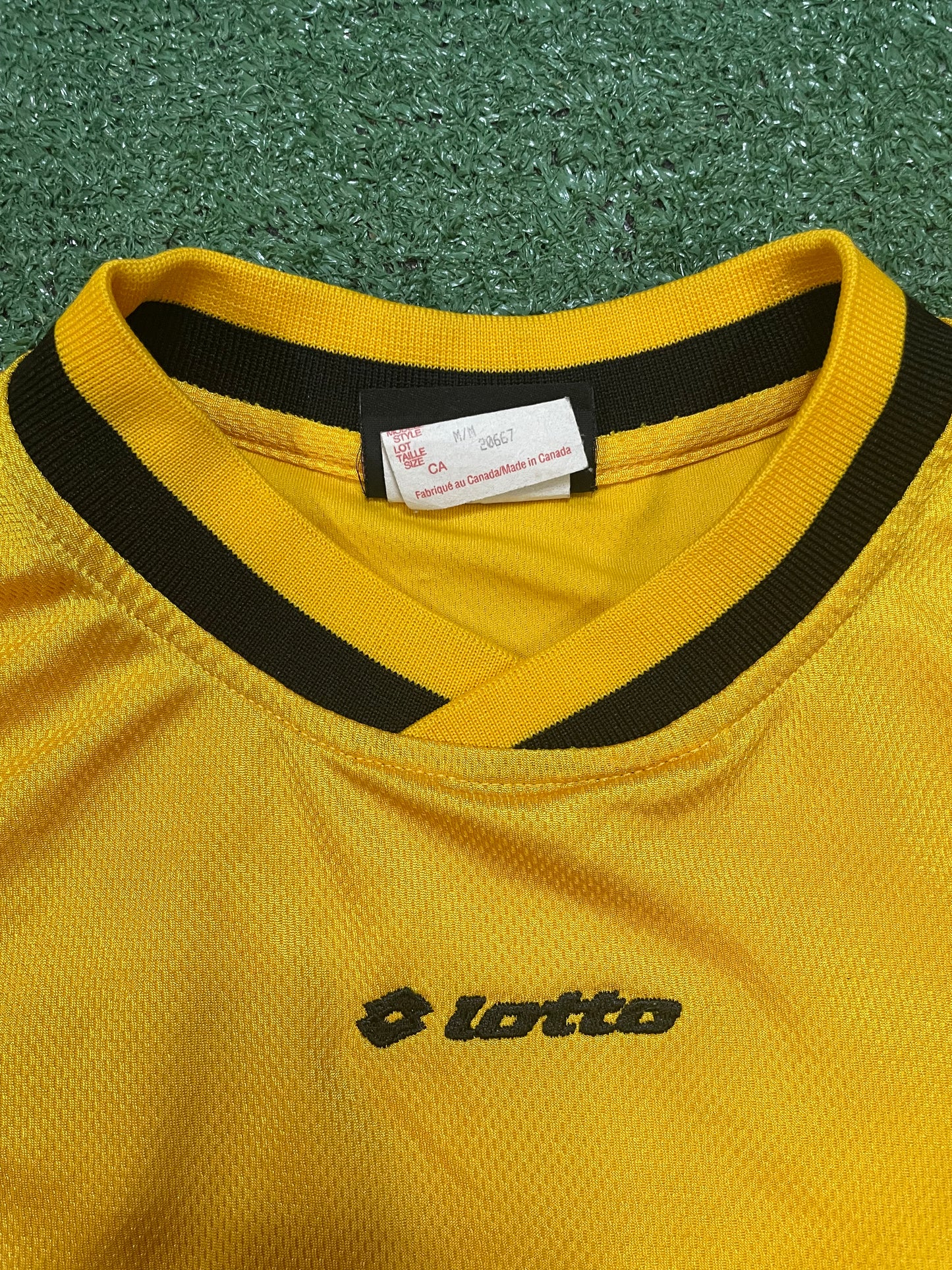 Vintage 1990s lotto black and yellow #69 jersey