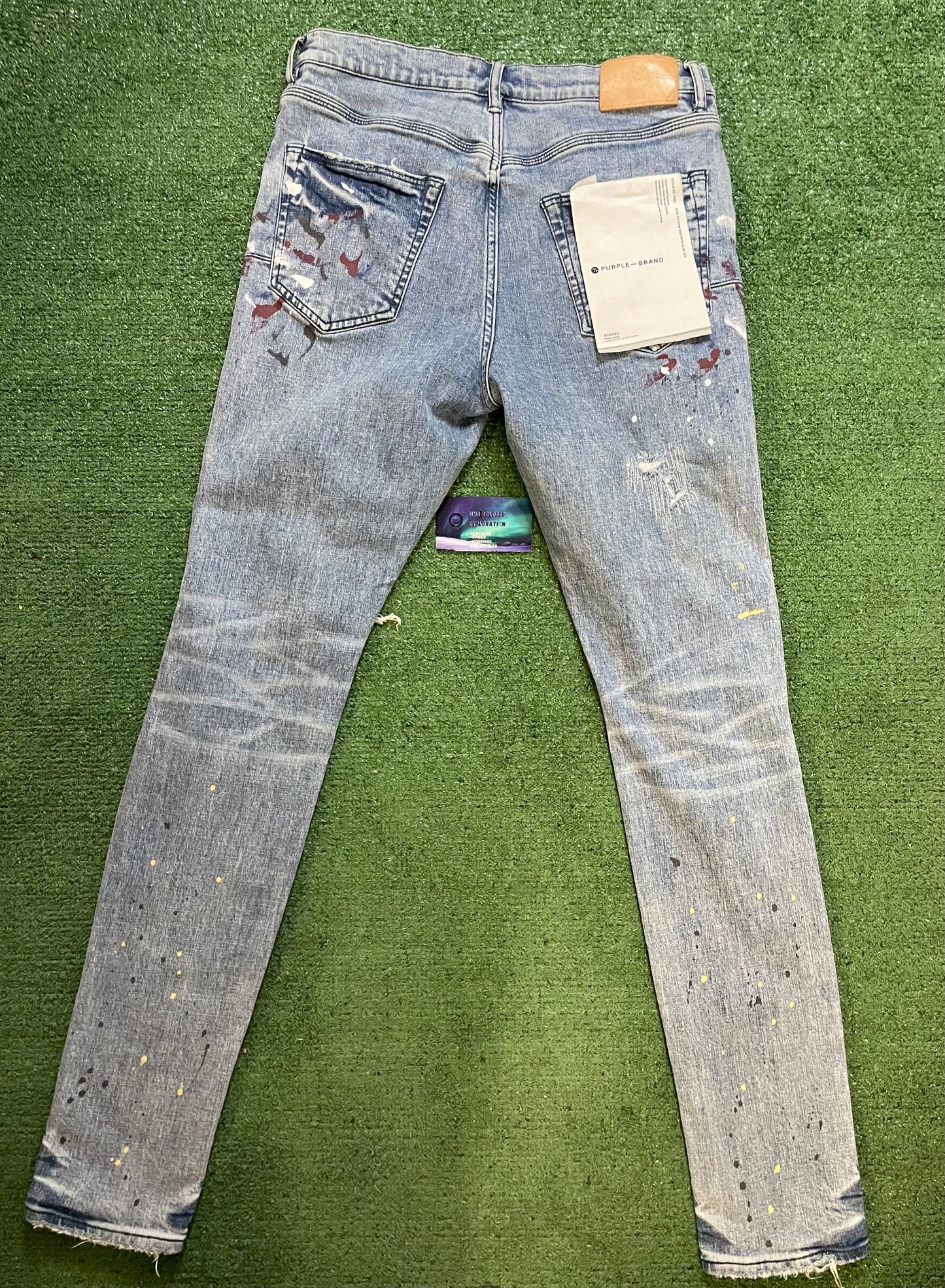 Purple brand paint splatter jeans