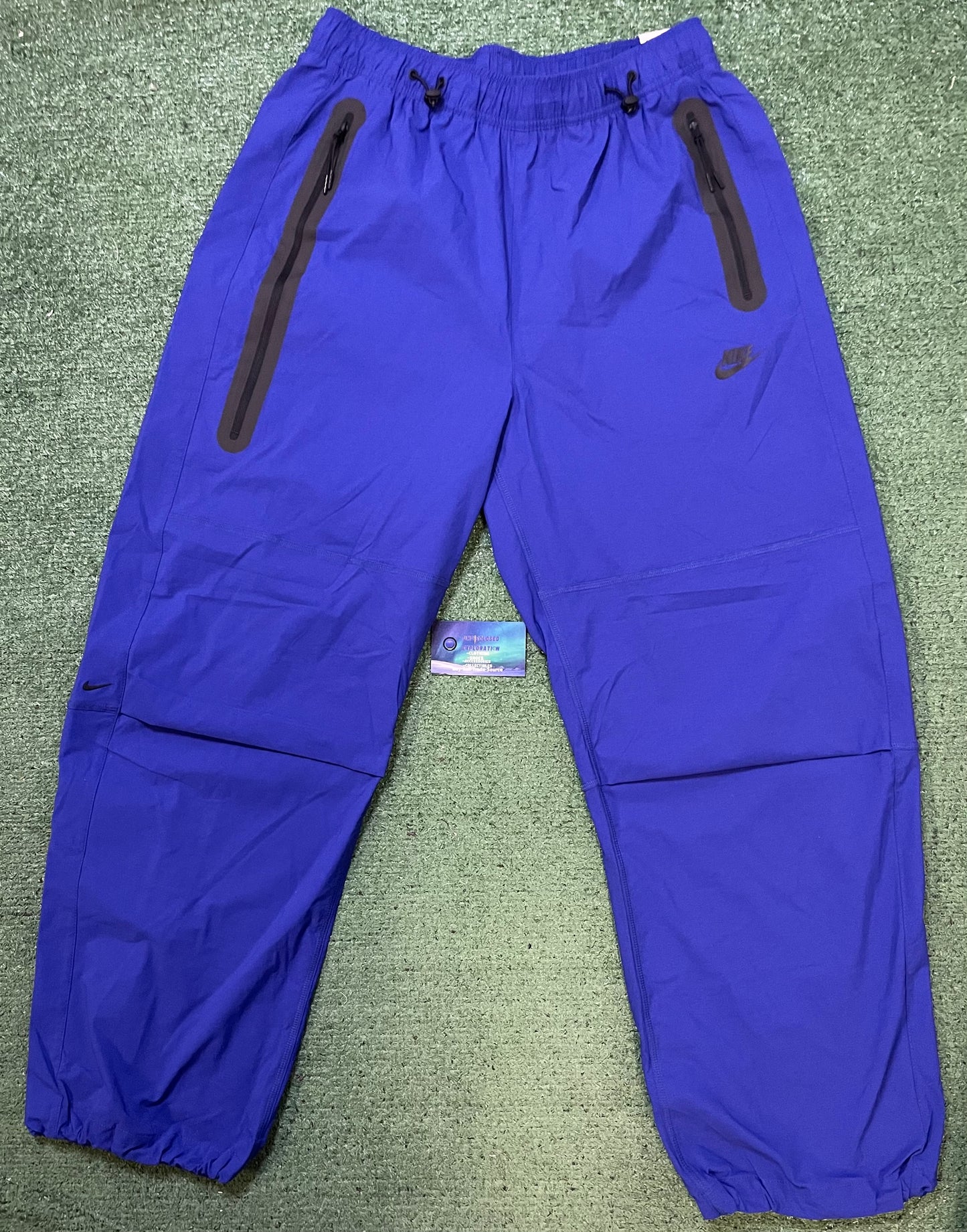 Nike tech woven blue pants