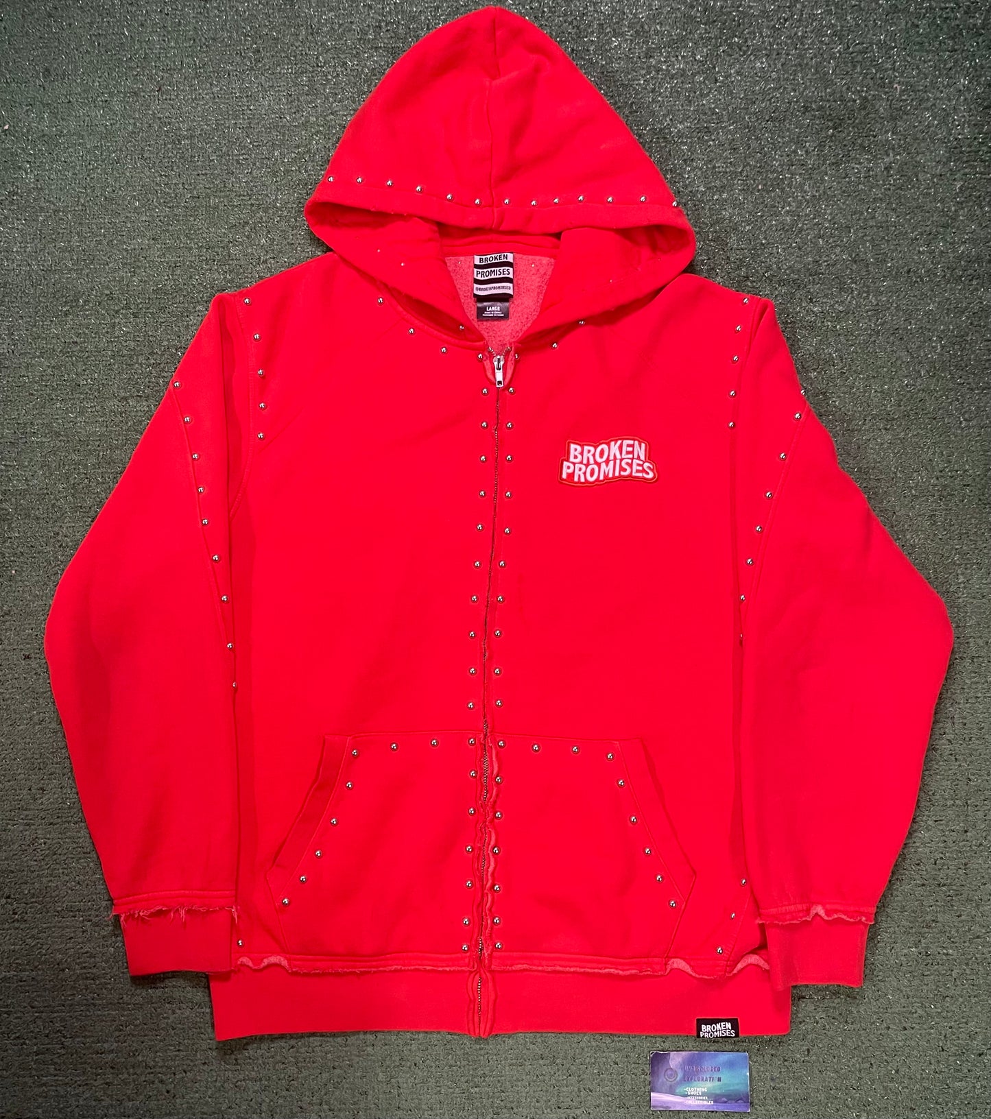 Broken Promises adorned red zip up hoodie