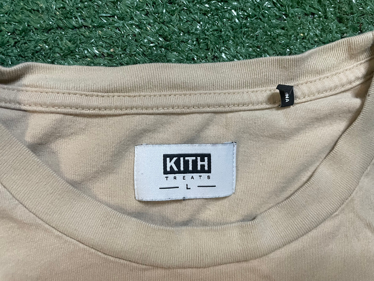 Kith treats delivered beige tee