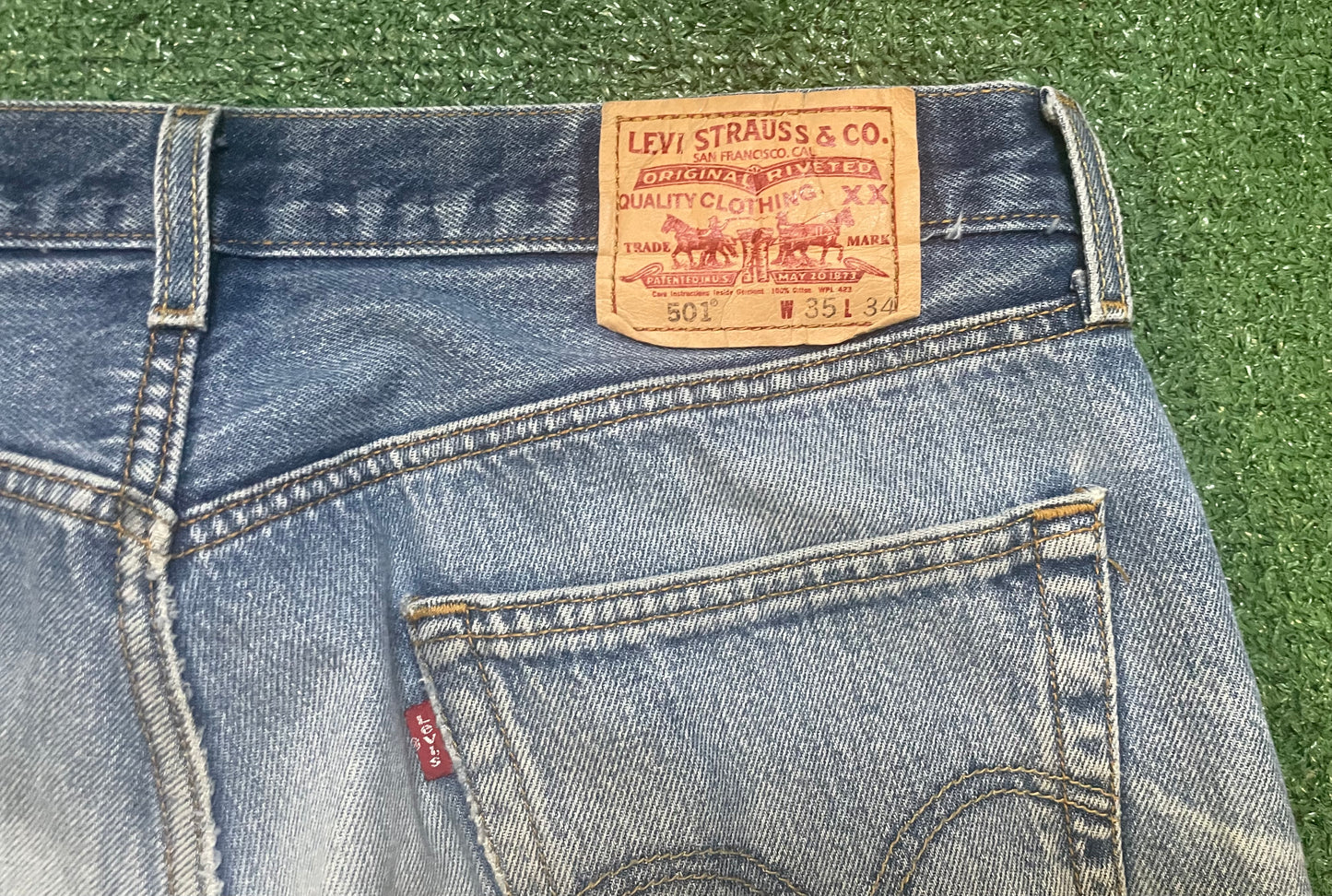Vintage Levi 501 light wash distressed jeans