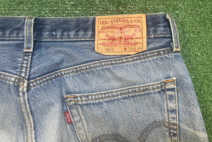 Vintage Levi 501 light wash distressed jeans