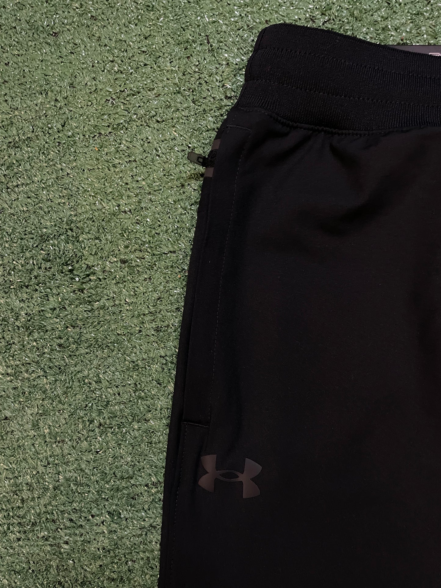 Under Armour woven sportswear taper pants