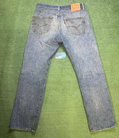 Levi’s 501 distressed jeans