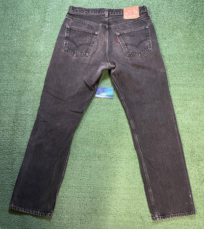 Vintage 1990s Levi’s 501 black faded jeans made in USA