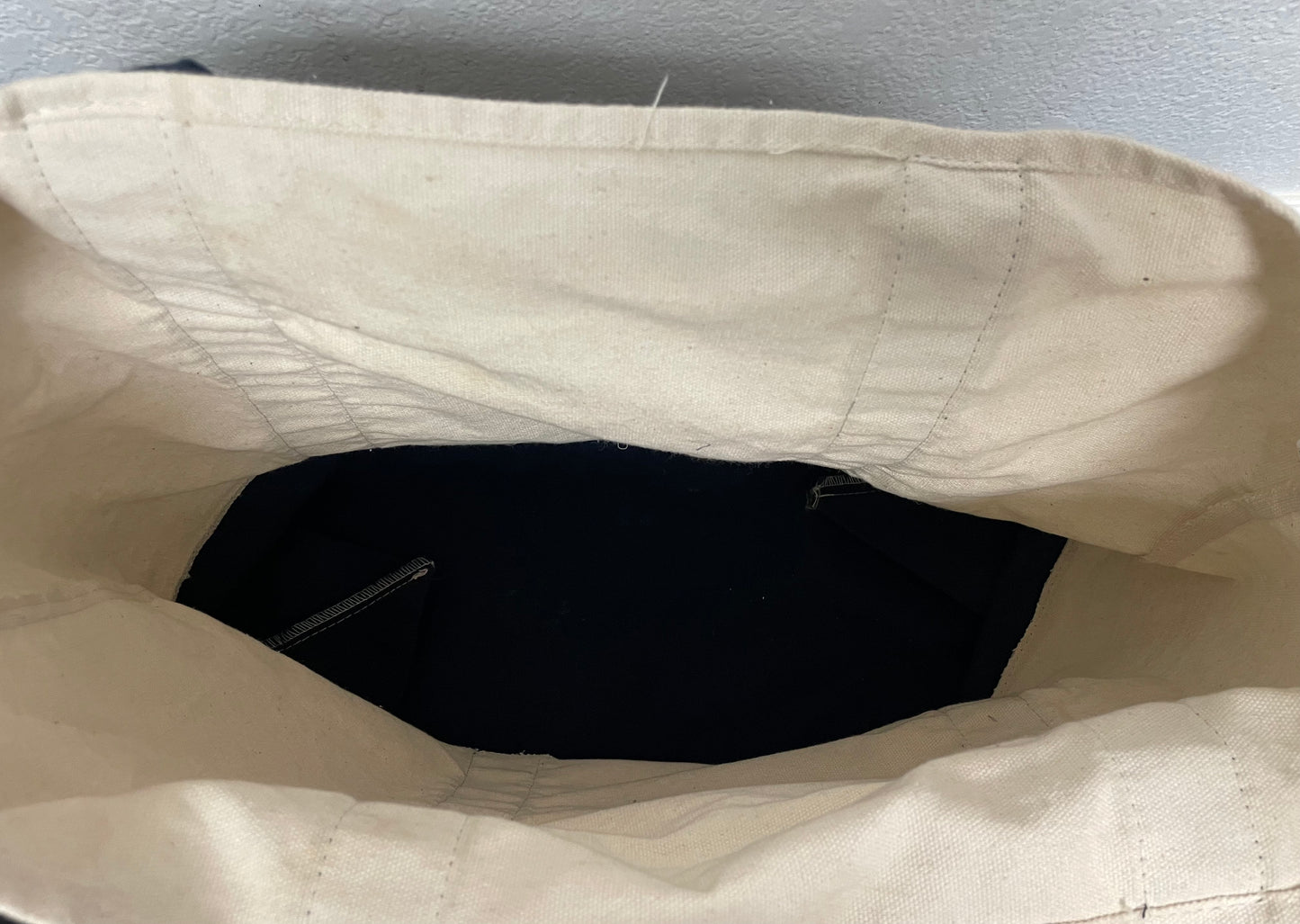 Trader Joe’s heavy duty cream and navy tote bag