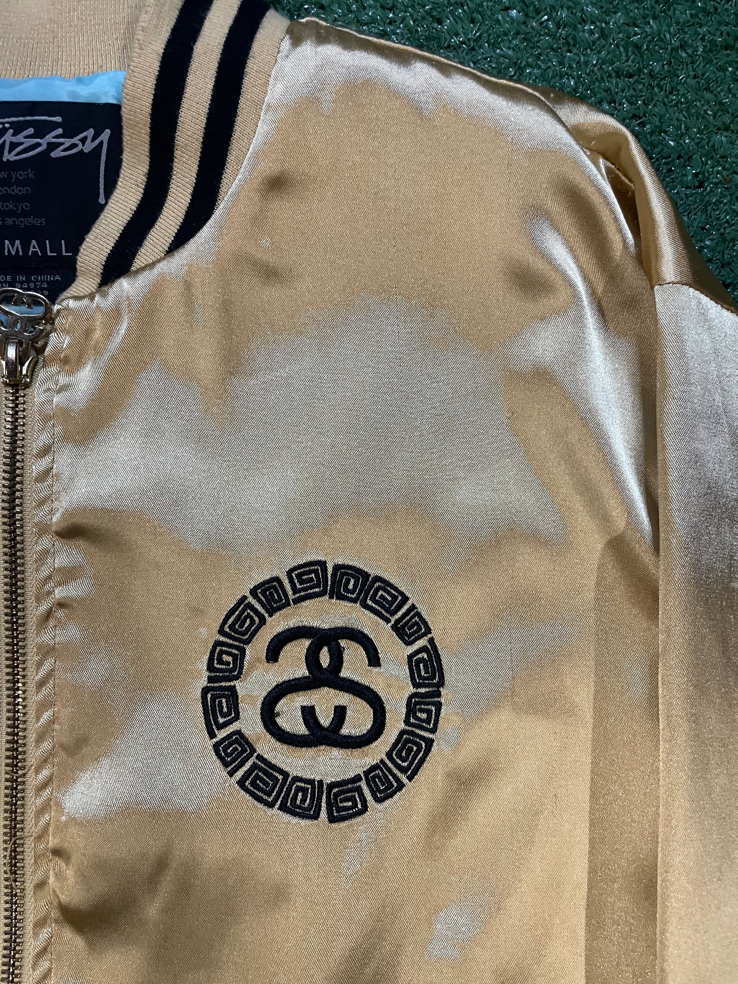 Vintage 2000s Stussy gold bomber jacket