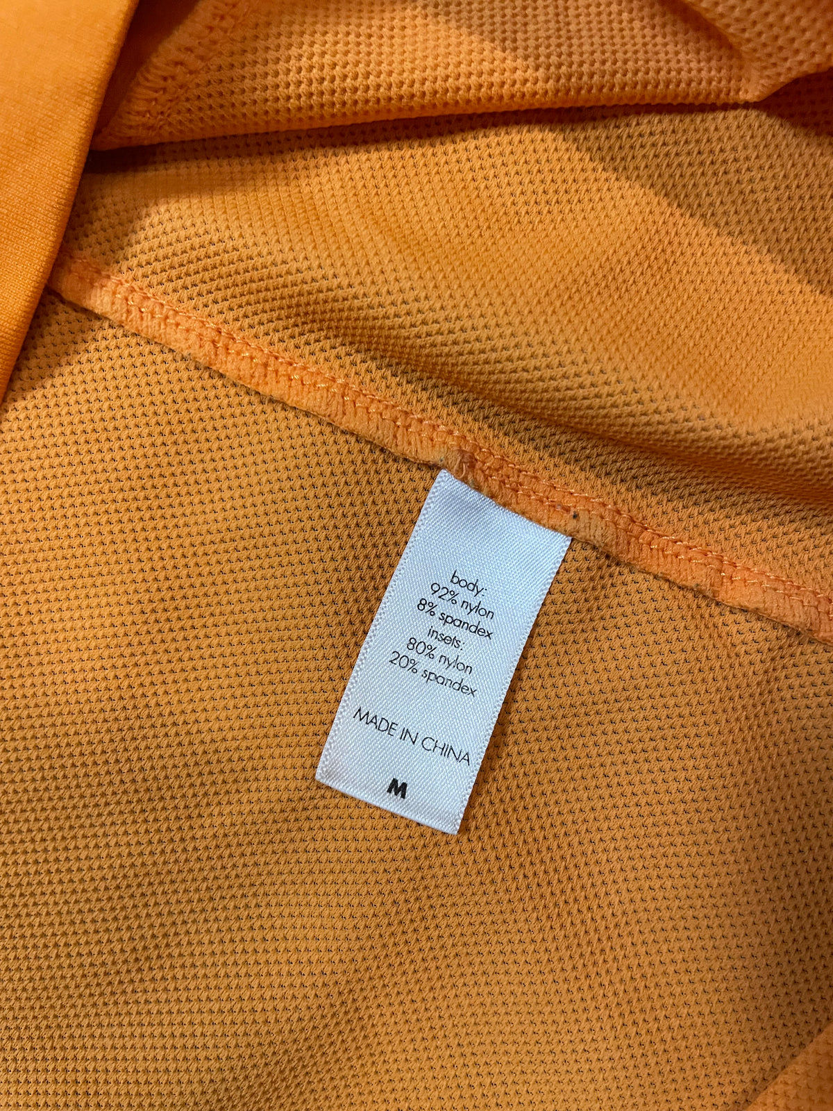 orange short sleeve zip up