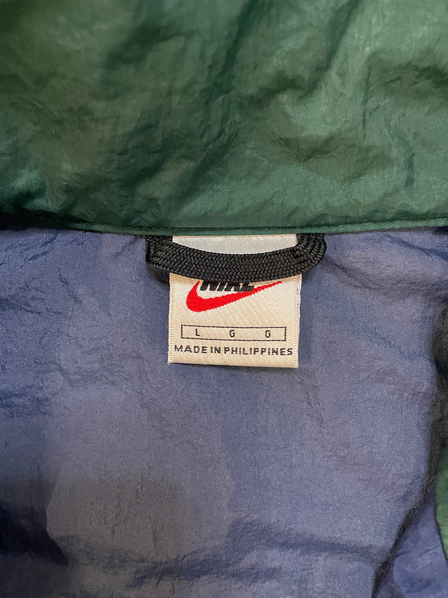 Vintage 1990s Nike blue green and white windbreaker jacket