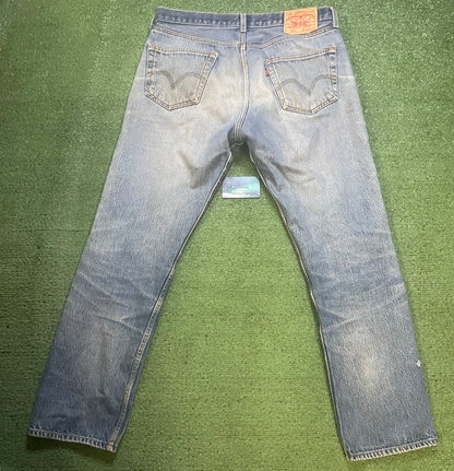 Vintage Levi 501 light wash distressed jeans