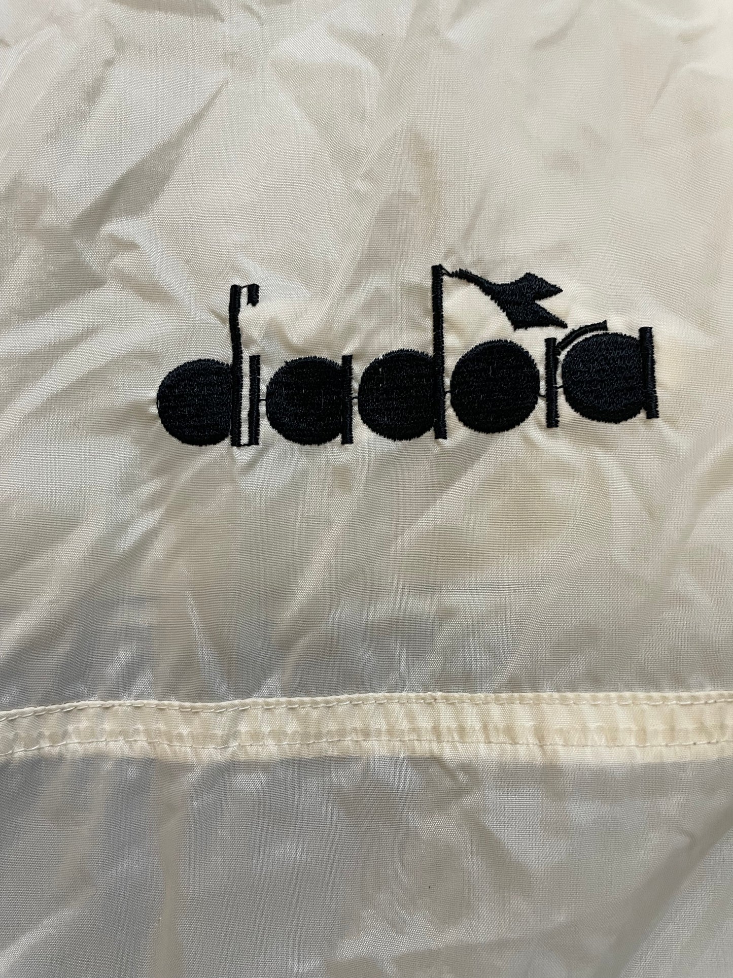 Vintage 1990s Diadora black and white windbreaker jacket