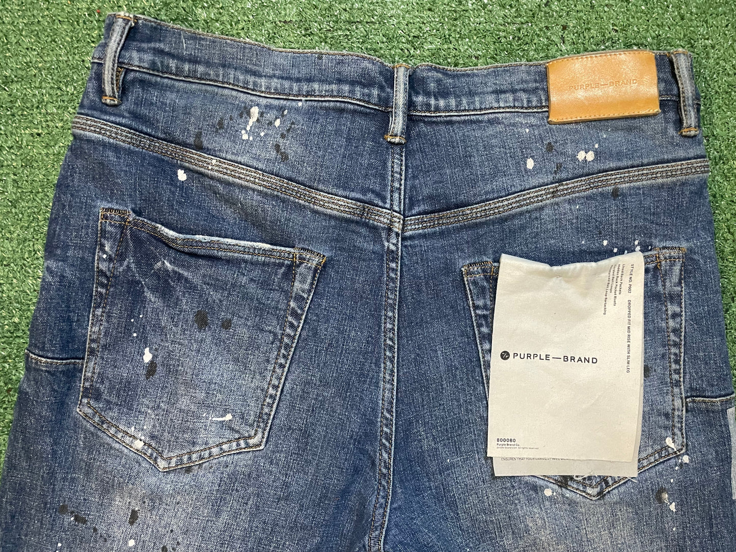 Purple Brand paint splatter jeans