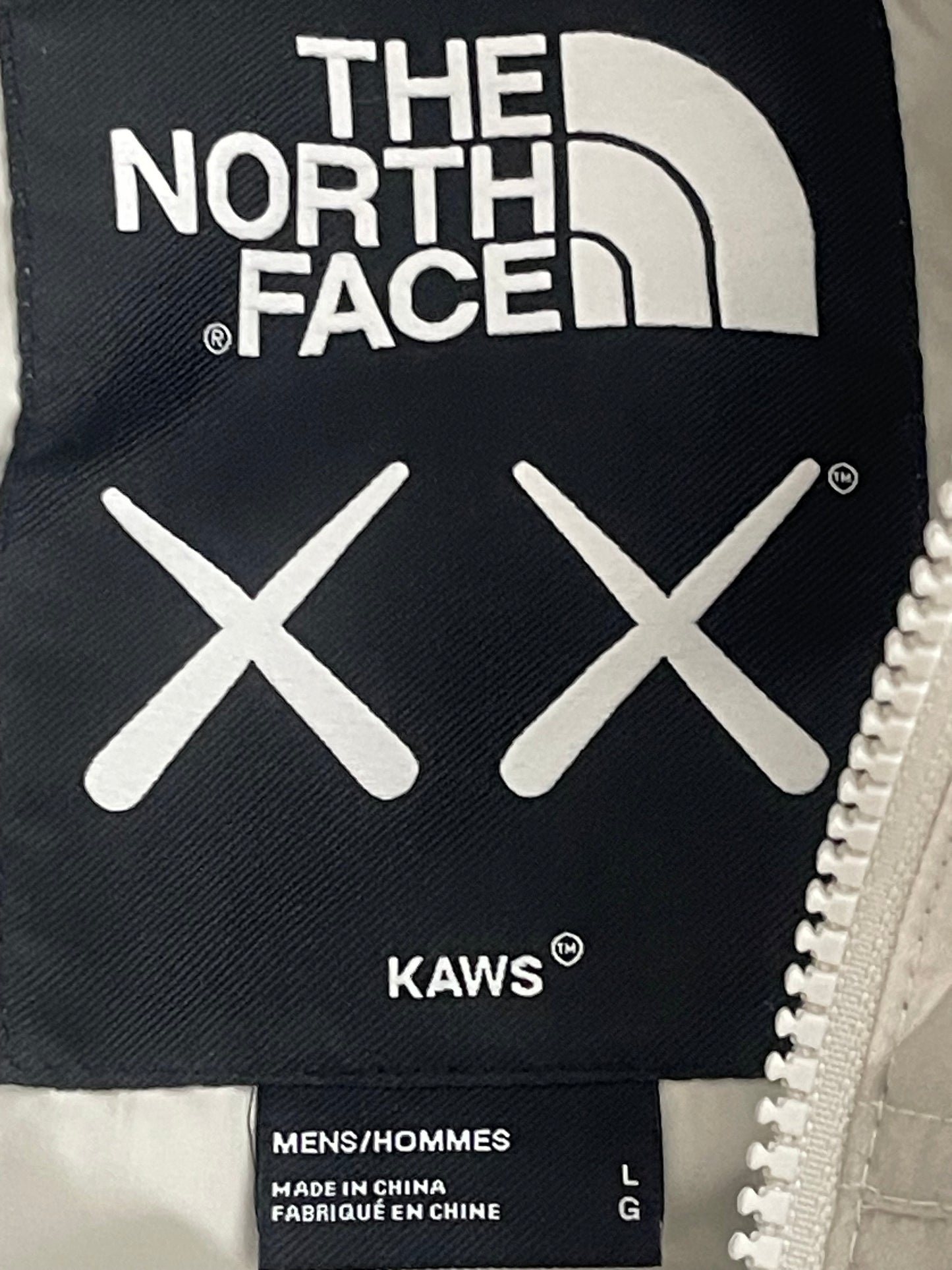 KAWS X The North Face Nuptse Moonlight Ivory