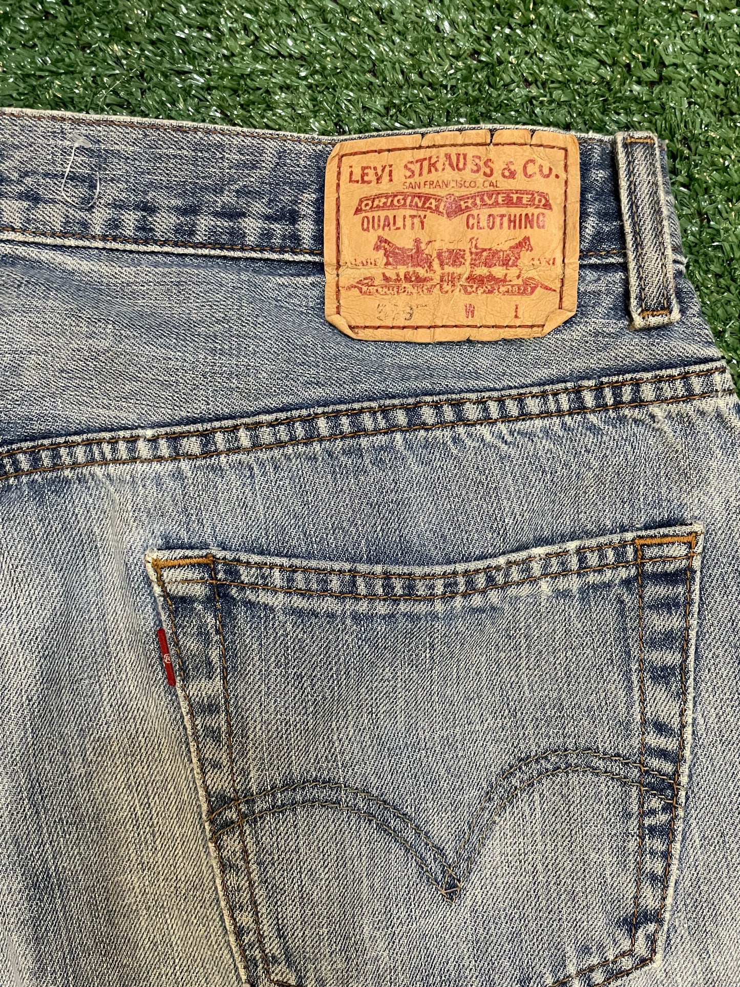 Levi 559 light wash distressed denim jeans