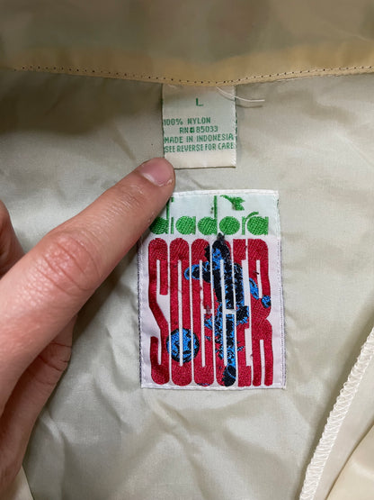 Vintage 1990s Diadora black and white windbreaker jacket