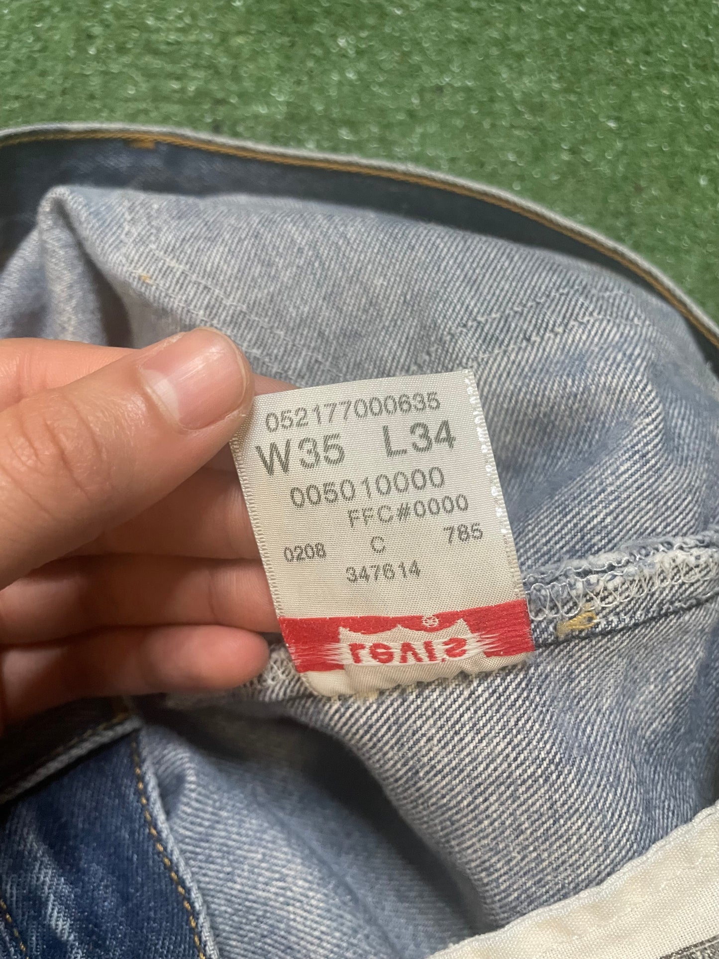Vintage Levi 501 light wash distressed jeans
