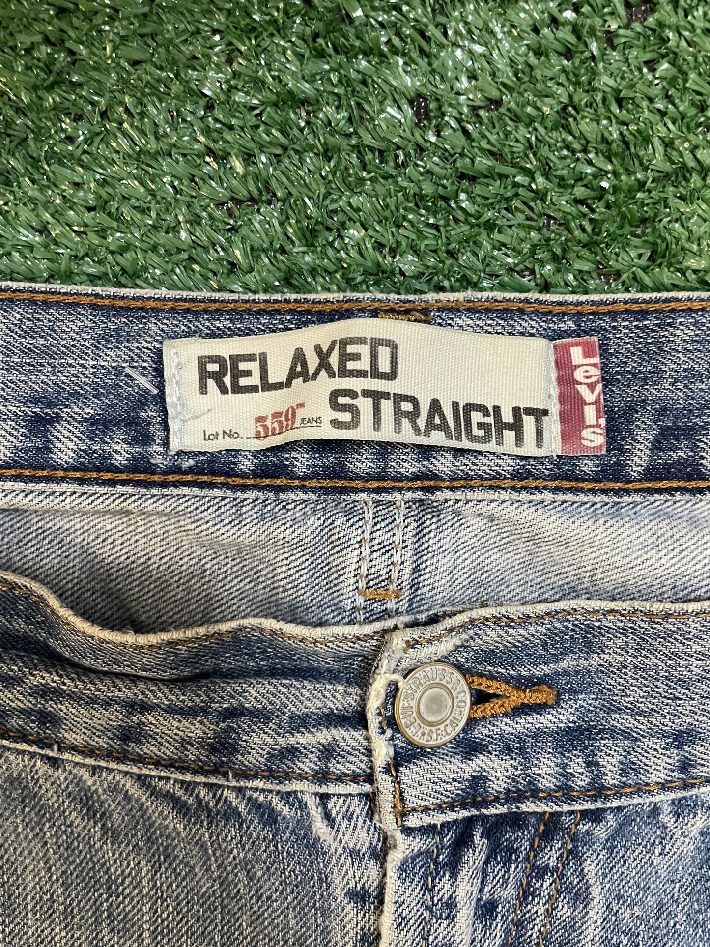Levi 559 light wash distressed denim jeans