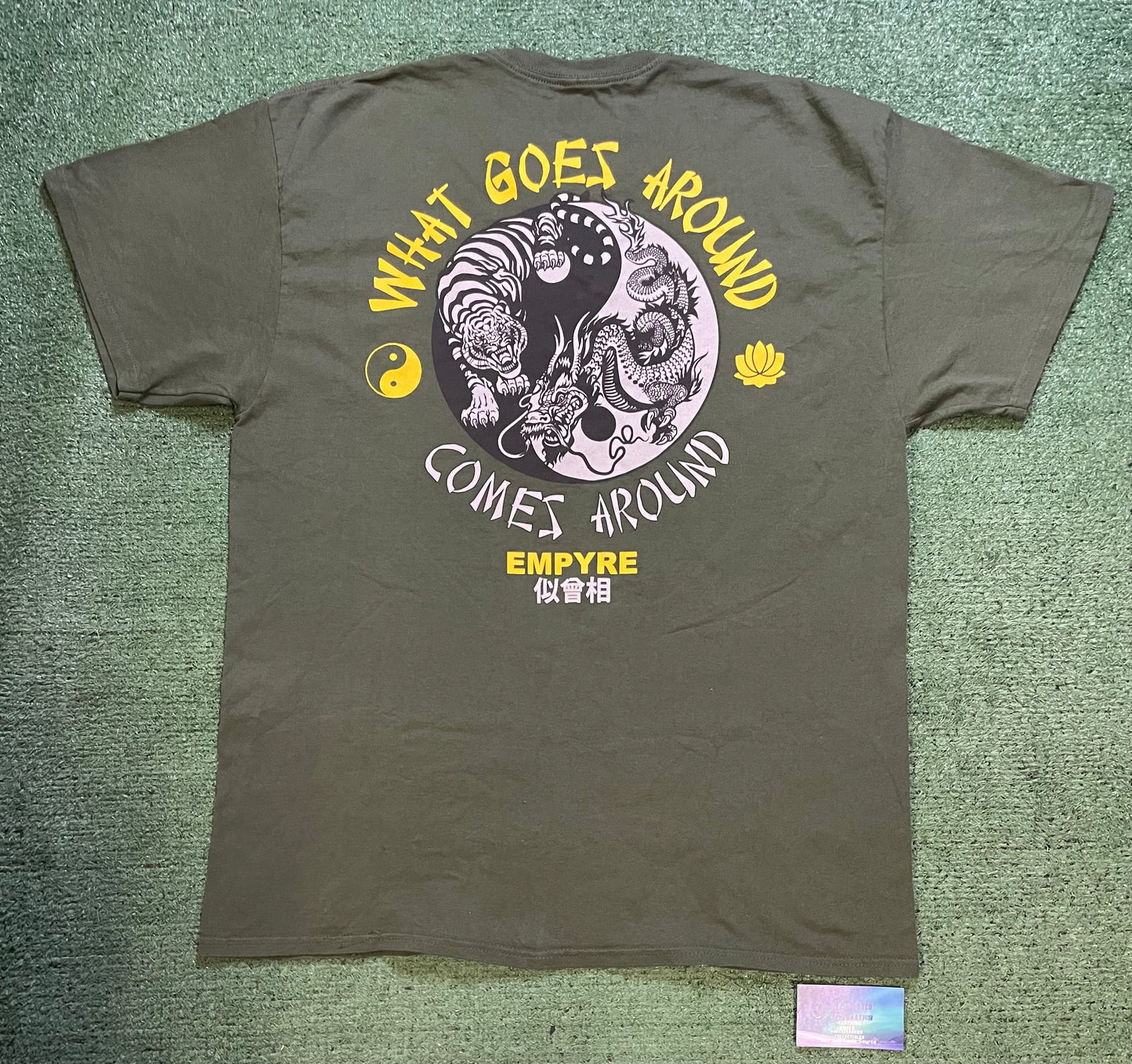 Empyre what goes around comes around green and yellow tee
