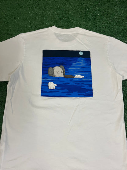 Kaws x Uniqlo floating artbook tee