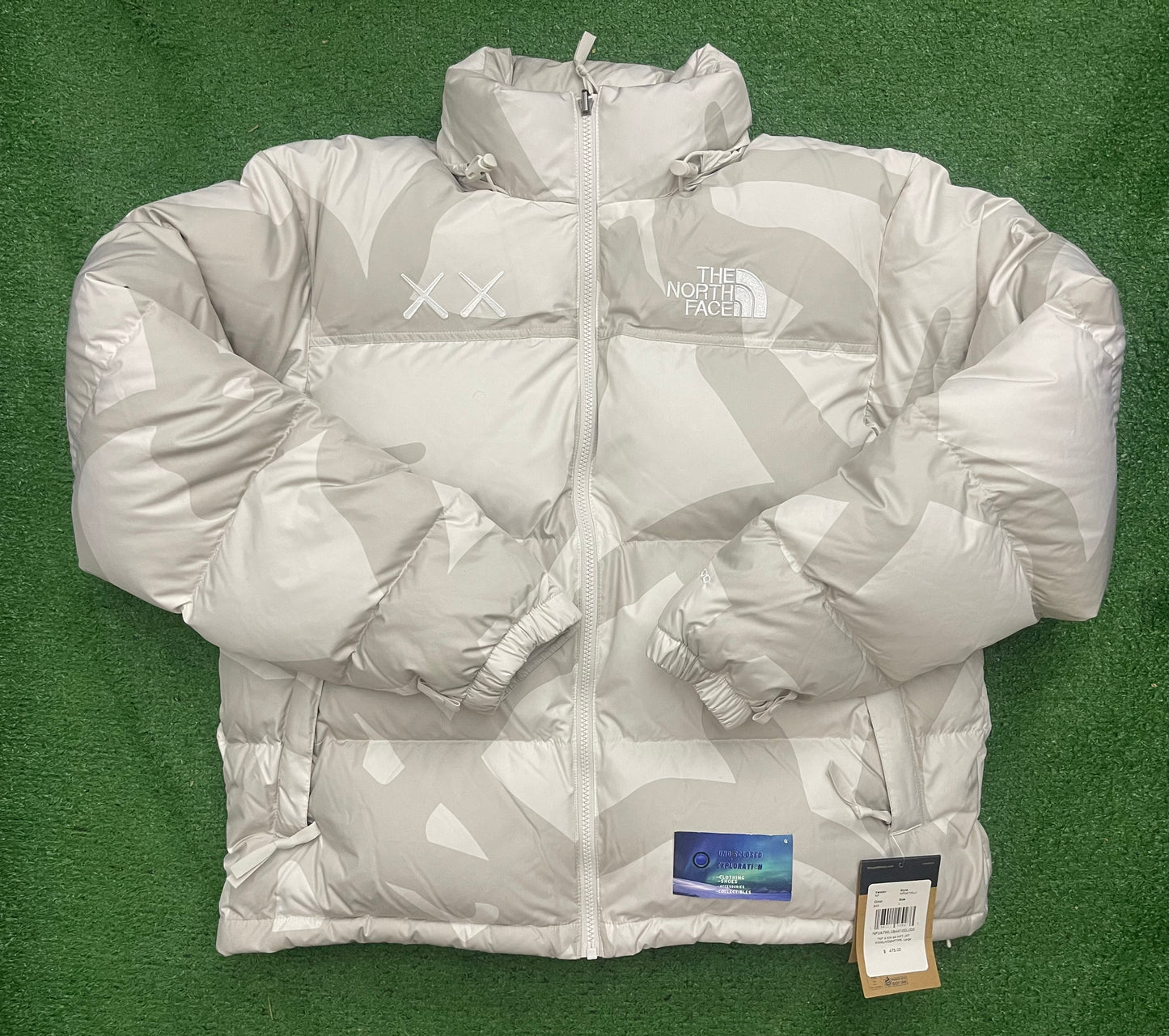 KAWS X The North Face Nuptse Moonlight Ivory
