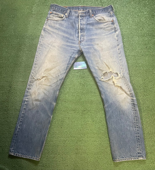 Vintage Levi 501 light wash distressed jeans