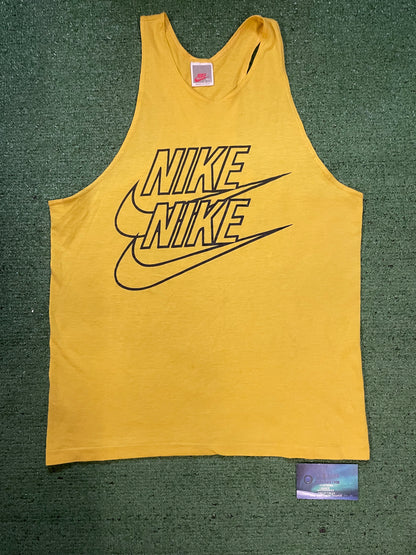 Vintage 1980s Nike repeat swoosh yellow tank top