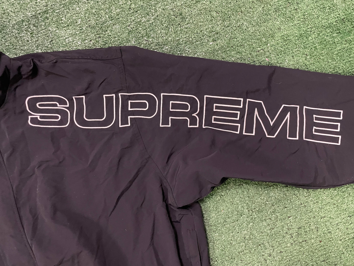 Supreme spellout embroidered black track jacket