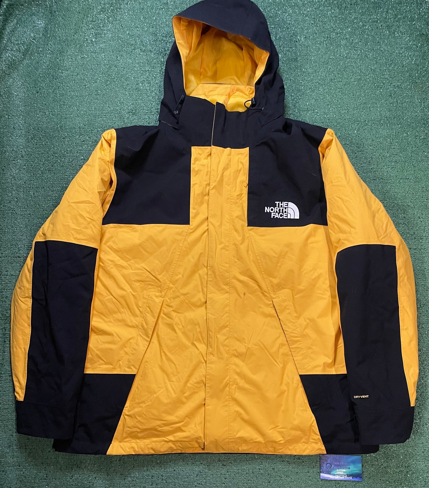 The North Face black & yellow mono mountain jacket