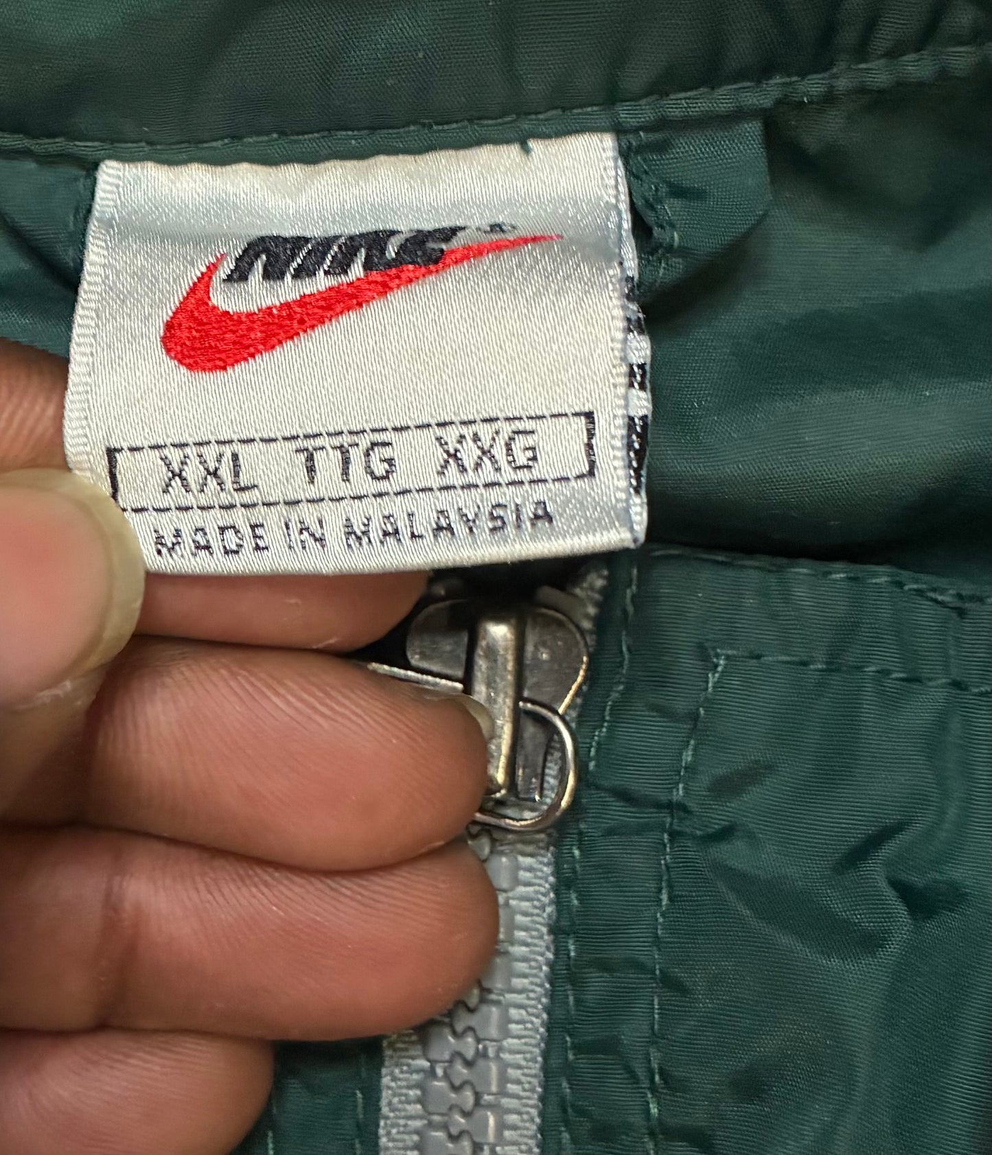 vintage 1990s forest green Nike full-zip windbreaker