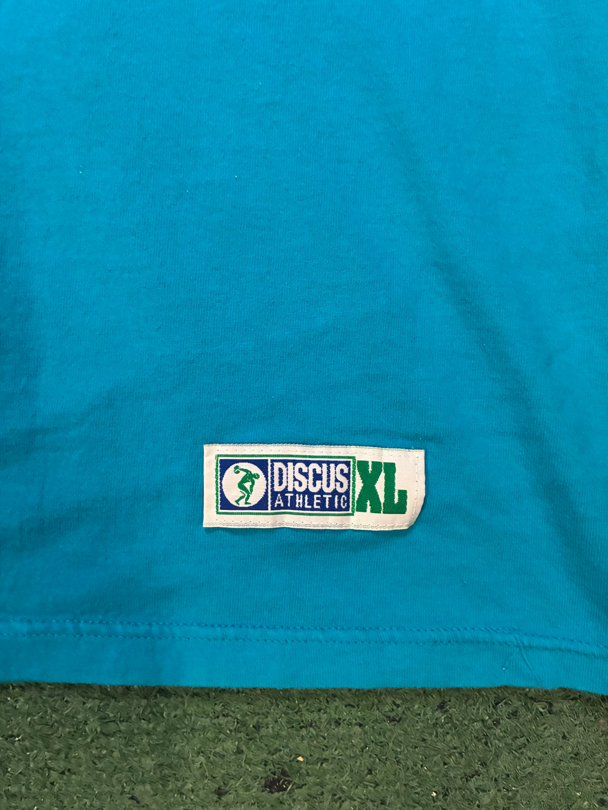 Vintage 1990s discuss athletics turquoise tee